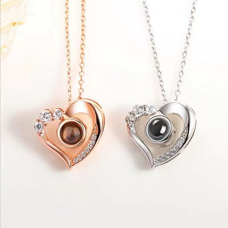 Silver necklace projection 100 languages heart pendant